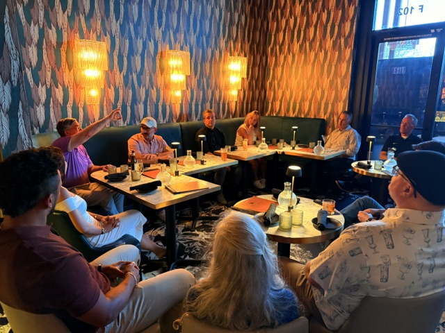 Members around small tables at a Society dinner in Scottsdale